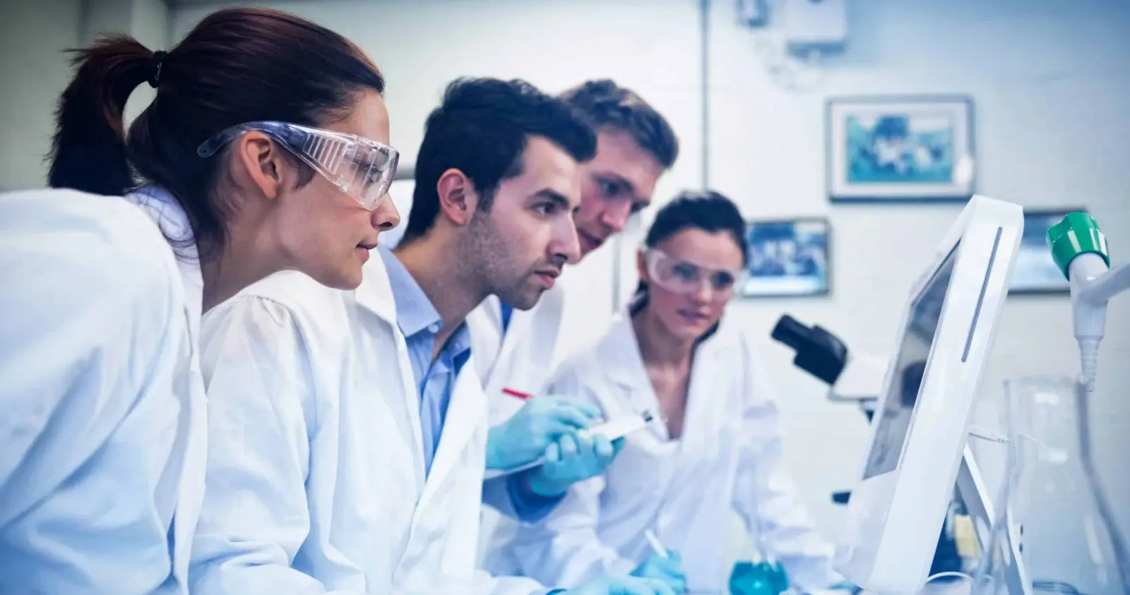 Laboratory team reviewing specimens